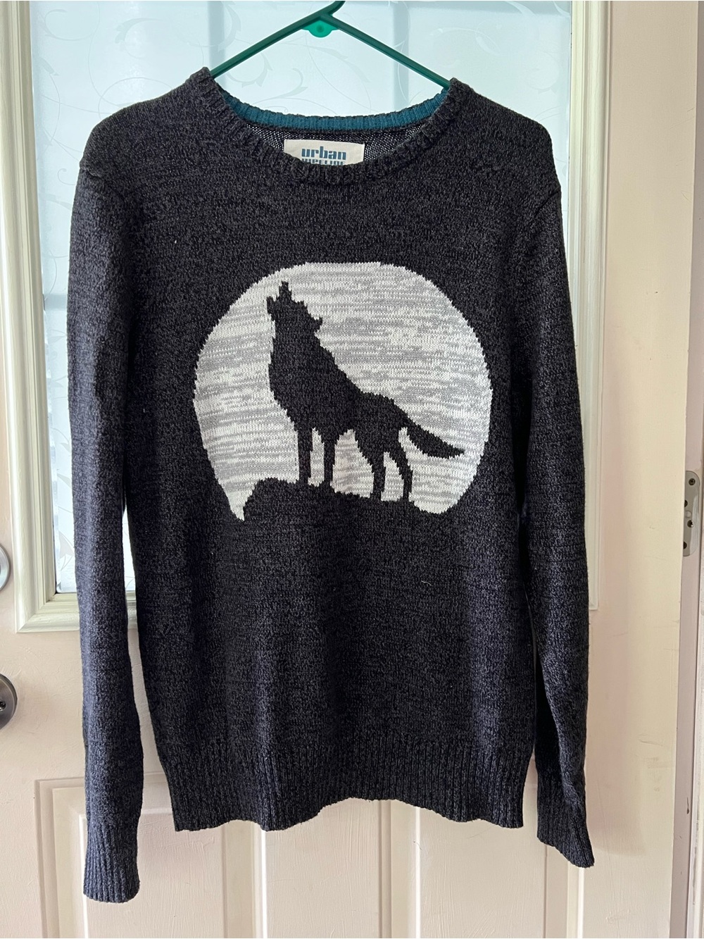 Urban Pipeline howling wolf with moon background crew neck sweater black/gray.